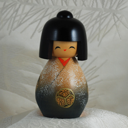 kokeshi doll with temari image