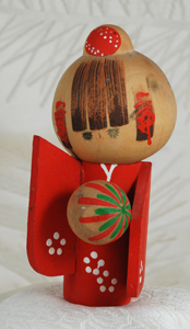 Kokeshi doll with temari ball